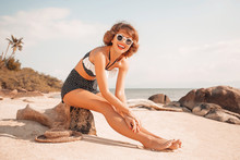 Attractive Young Woman In Bikini On The Beach