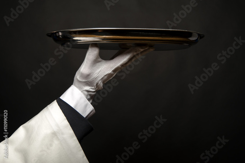 Waiter Hand Holding Tray Over Black Background Stock Photo Adobe Stock Closeup of a waiter in a tuxedo holding a serving tray under his arm. waiter hand holding tray over black