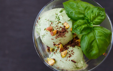 Wall Mural - Homemade organic green ice cream - Basil, pistachio, green tea, mint. A refreshing summer dessert. Selective focus
