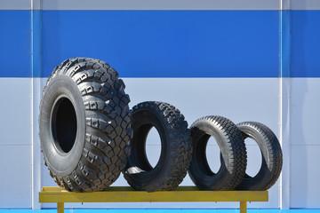 Different sizes of tires for cars at the stand