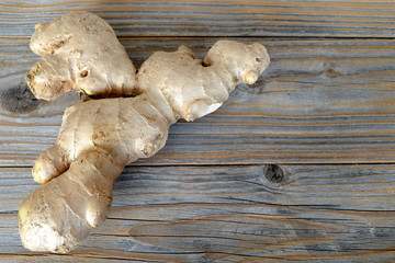 Ginger root on wooden background