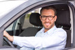 © Production Perig - Young attractive man driving his car