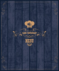 Wall Mural - Cover for restaurant menu with a toque and cutlery on a wooden boards background texture