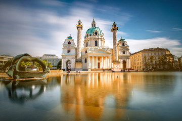 Canvas Print - View on st. Charles's church on Karlsplatz in Vienna. Long exposure technic with blurred clouds and glossy water