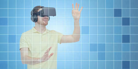 happy man in virtual reality headset or 3d glasses