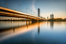 View On Donaucity With Bridge In Vienna In The Morning. Wide Angle Image With Long Exposure Technic With Glossy Water And Reflection