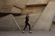 © fesenko - young business woman walking outdoors