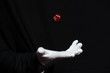 © Drobot Dean - Hand of magician in white glove showing tricks with dice