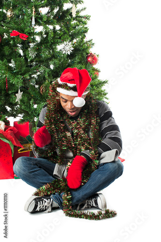 African American Man With Christmas Decorations Buy This Stock