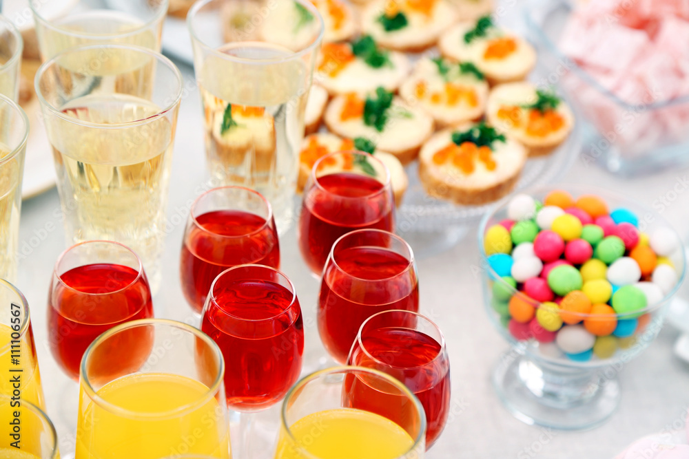 Set of cold snacks, canape, beverages and dessert, closeup