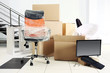 © Africa Studio - Move concept. Unpacking cardboard boxes in a new office