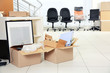 © Africa Studio - Move concept. Unpacking cardboard boxes in a new office