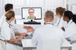 Doctors Videoconferencing On Computer In Hospital