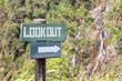 Lookout sign with arrow to waterfall in Belize