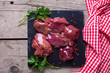 Raw chicken liver on slate board