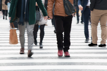 Motion blurred  people across Pedestrians at Shibuya Junction, T