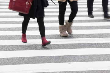 Motion blurred  people across Pedestrians at Shibuya Junction, T