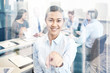 © Syda Productions - group of smiling businesspeople meeting in office