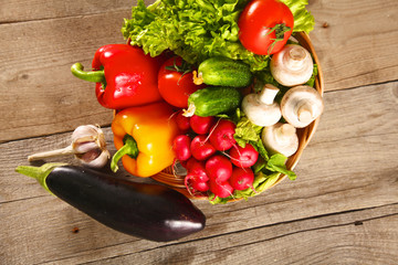 Wall Mural - Vegetables . Fresh Bio Vegetable in a Basket. Over Nature Background