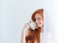 Happy Redhead Woman Posing With Rabbit