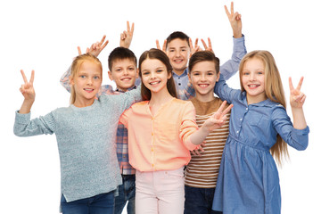 Wall Mural - happy children showing peace hand sign