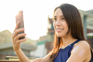 Wall Mural - Woman use of cellphone at outdoor