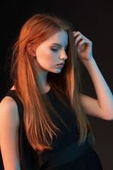 Fashion portrait of beautiful red haired girl