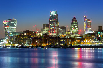 Wall Mural - Cityscape of London with reflection in Thames river at night, UK