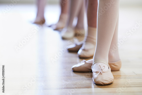 Close Up Of Feet In Children's Ballet Dancing Class Plakát