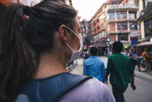Young  Woman With Face Mask In The Streets Of Kathmandu
