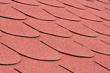 Red Shingles On A Roof In Close Up