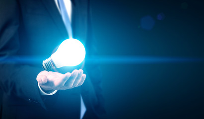 Poster - businessman with illuminated lamp