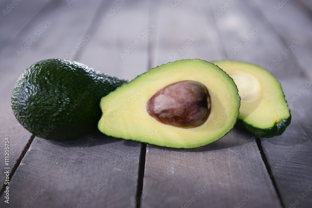 Fresh avocado on wooden background