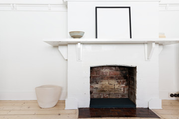 White brick fire place in vintage styled interior