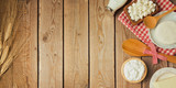 Fototapeta Mapy - Farm fresh dairy products on wooden table. View from above. Flat lay