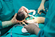 Real operation for cesarean section with new born infant in operating theater.