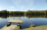 Fototapeta Pomosty - A very littel jetty at the shore of a river in the North of Sweden.