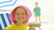 © izuboky - child close up portrait happy smile summer camp sitting chair umbrella selective focus backlight