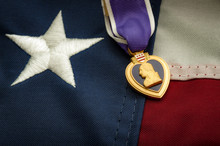 The Purple Heart Is A United States Military Decoration Awarded In The Name Of The President To Those Wounded Or Killed While Serving And The American Flag