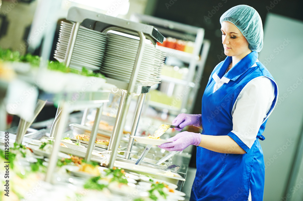 buffet female worker servicing food in cafeteria Stock Photo | Adobe Stock