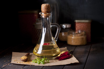 oil and spices on dark background