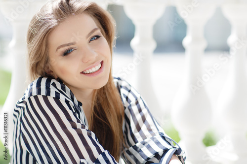 Portrait Of A Happy Woman In Spring City Blonde Long Straight