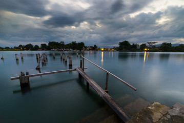 Wall Mural - Old jetty on lake, long exposure at dusk, Sulawesi, Indonesia