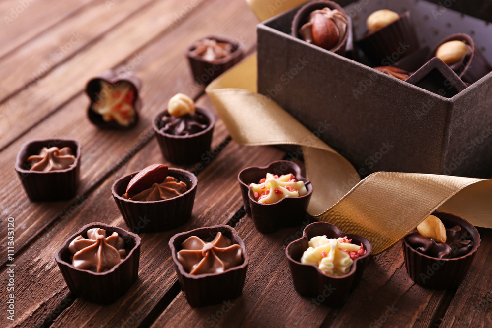Chocolate sweets on wooden background