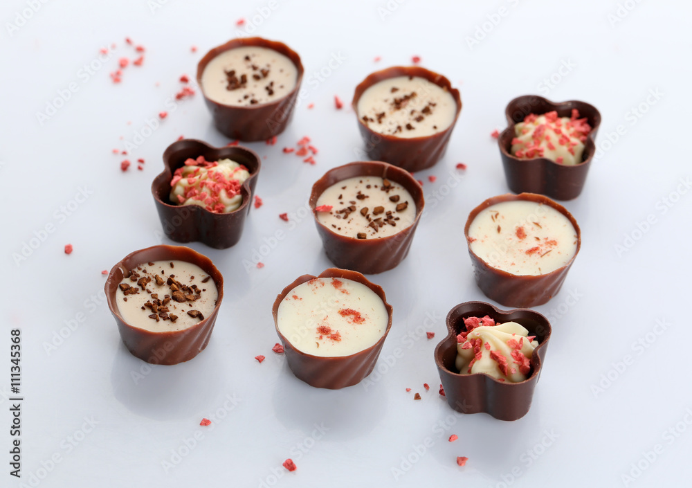 Assorted chocolate candies, isolated on white