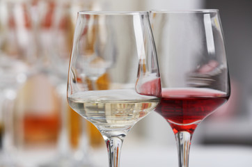 Poster - Wine glasses with red and white wine, closeup