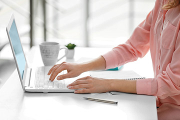 Poster - Businesswoman typing on keyboard in office