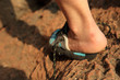 © lzf - injured rock climber heel stand on stone