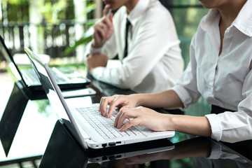 business woman hand typing on laptop keyboard