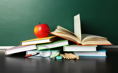 Poster - School books on desk near chalkboard